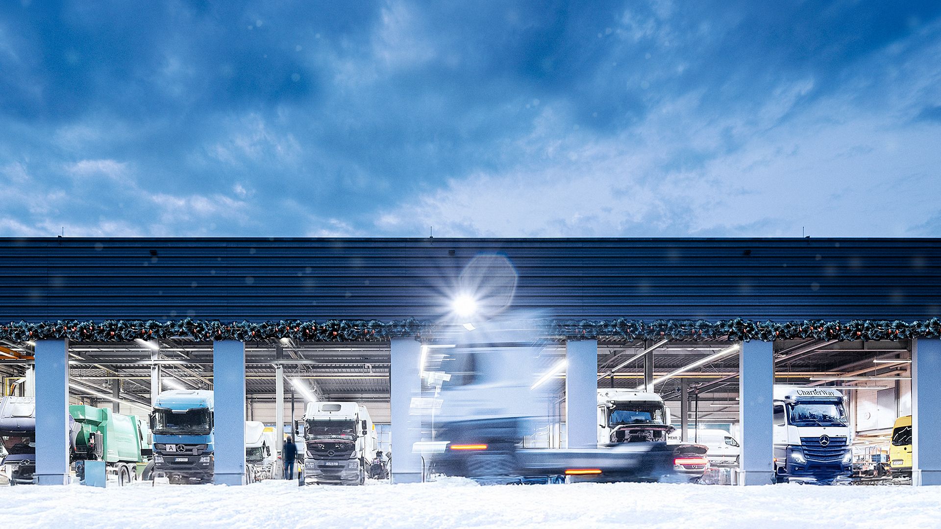 LKW fährt an Werkstatt vorbei